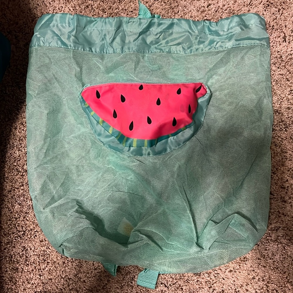 Super cute backpack beach tote.  Folds up to cute watermelon bag.  New